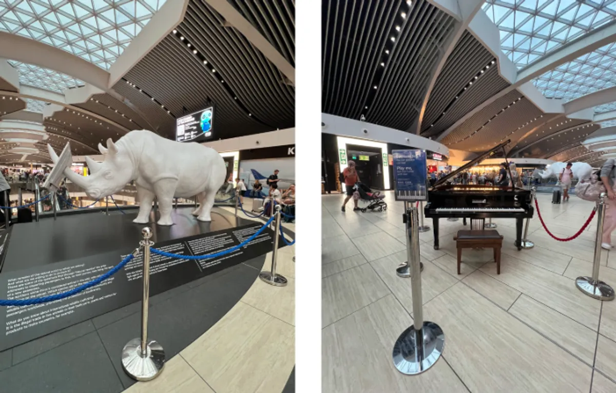A rhinoceros sculpture and piano at FCO